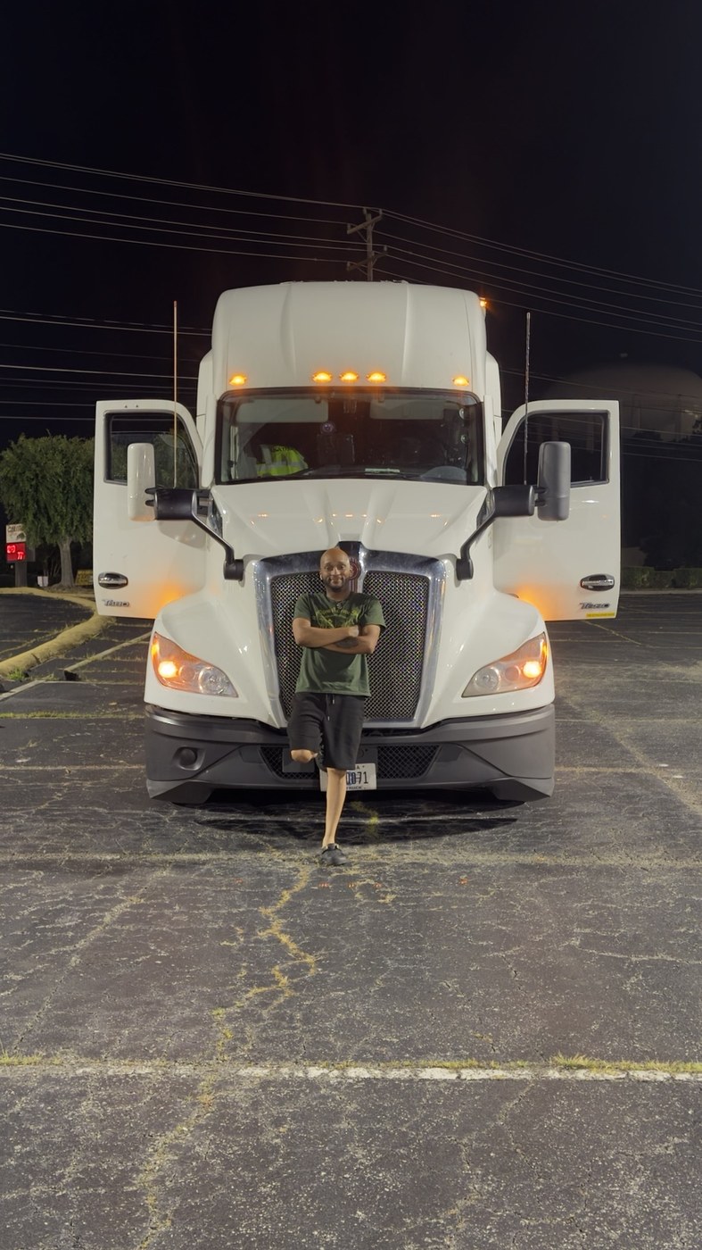 Travis Lewter standing in front of KT World Solutions truck